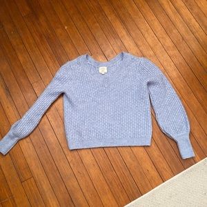this cropped sweater is super cute and a heavy material so will keep you warm!